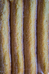 row of biscuits biscuits in a typical package of the Savoy royal family suitable for a typical Italian dessert called 