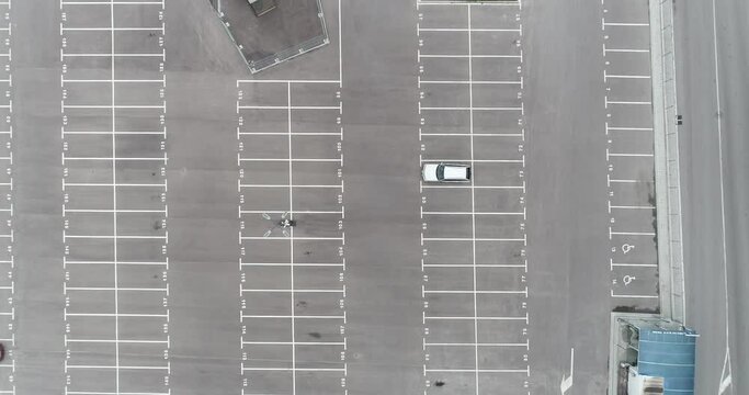 Aerial footage of empty parking lot. Road marking. Parking space