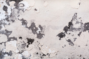 Concrete, weathered, worn, damaged wall paint. Rough, concrete surface with cracks and scratches. Great background or texture.
