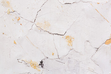 Concrete, weathered, worn, damaged wall paint. Rough, concrete surface with cracks and scratches. Great background or texture.
