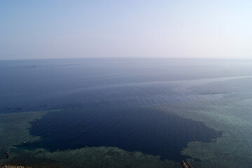 Top view of the Blue hole in Dahab (Egypt, South Sinai). Ripples on the water. Natural curvature of the horizon line