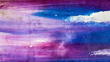 Abstract creative background of chaotic strokes of old cracked paint on concrete wall. Old surface with traces of paint, weathered, scratches and cracks for design