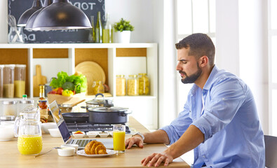 a business man breakfasts with notebook and juice