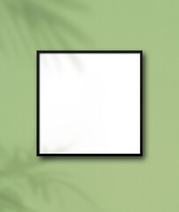 blank picture frame on green wall