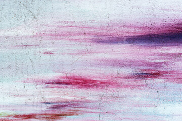 Fototapeta na wymiar Abstract creative background of chaotic strokes of old cracked paint on concrete wall. Old surface with traces of paint, weathered, scratches and cracks for design