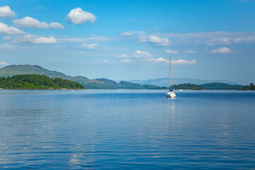 Fototapeta na wymiar Loch Lomond, a big lake at Highlands in Scotland, on a sunny day.