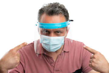 Adult male pointing index fingers at protective screen