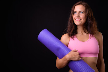 Portrait of happy young beautiful woman ready for gym