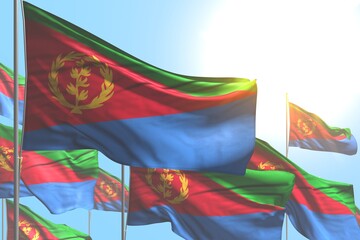 wonderful many Eritrea flags are waving on blue sky background - any holiday flag 3d illustration..