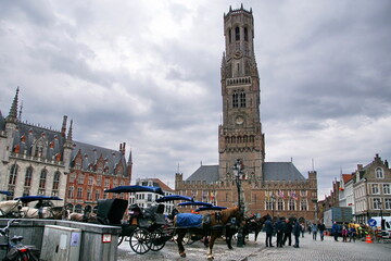 Market square in the historical center of Bruges with the Belfort tower. Bruges (Brugge) is a...