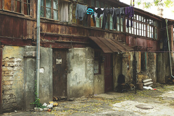 Fototapeta na wymiar Toning landscape of destroyed homes in a poor quarter for the poor people.