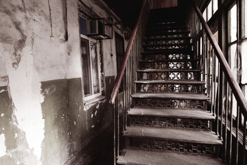 An old metal staircase leading up in a poor quarter of the city