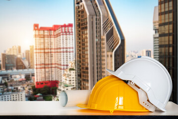 Construction house and building. Repair work. Drawings for building and helmet on white desk