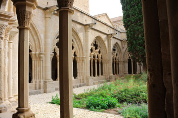 Inside view of the vaulted galleries of the courtyard of the Monastery of Poblet (cat. Reial Monestir de Santa Maria de Poblet) - Cistercian monastery.