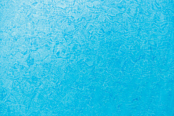 Texture of blue pool water. Ripples in the water