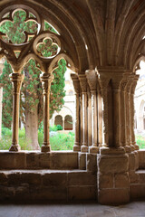 Beautiful stone arch and view of the courtyard of the Poblet monastery (cat. Reial Monestir de Santa Maria de Poblet).Vimbodi-and Poblet. Spain...