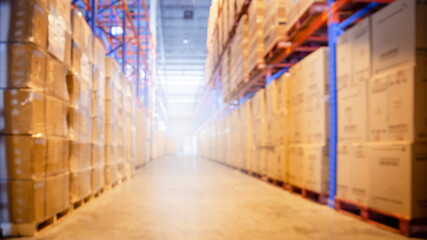 Fototapeta premium Blurred Warehouse inventory cargo storage with tall shelves. Business and Industrial logistics background.