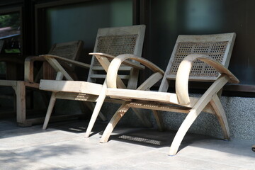old wooden chairs under the shade