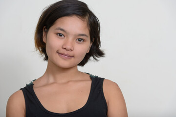 Portrait of young Asian teenage girl with short hair