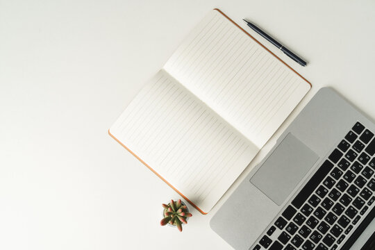 Open Laptop With Blank Notebook, View From Above. Workplace Concept