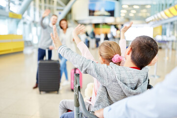Children waving at the airport