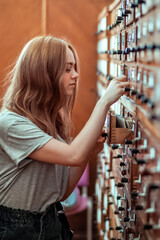 Ginger hair girl with casual clothes searching for old books
