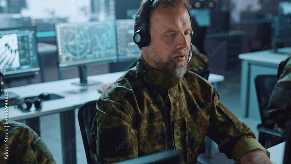Aufkleber Military Surveillance Team of Officers in Headsets Working in a Central Office Hub for Cyber Operations, Control and Monitoring for Managing National Security, Technology and Army Communications.