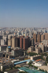 Top view of XI'an city.Panorama. Lots of high-rise buildings, old houses, tennis courts against the blue sky. China.