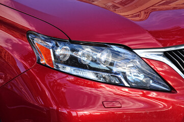 Closeup headlights red car