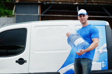 Delivery men in front cargo van delivering bottles of water.