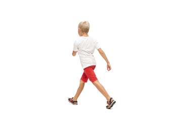 Target. Happy kids, little and emotional caucasian boy jumping and running isolated on white...