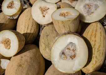 A colorful assortment of fresh fruits and vegetables neatly and attractively arranged on stands for sale at Riga Central Market, Latvia.