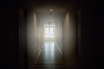Dark and light corridor in the apartment .