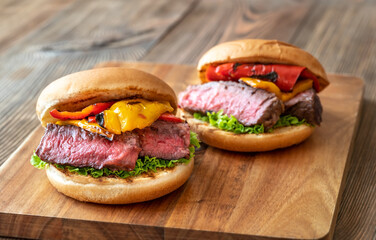Burgers with grilled steak and bell peppers
