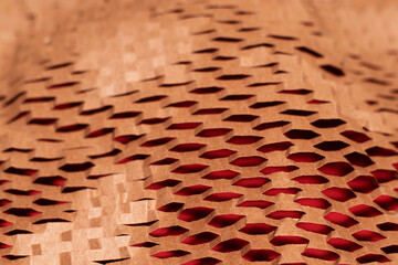 A sheet of cut paper pattern texture on a red background. The macro photo was shot for your design.