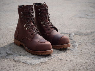 Naklejka premium Men fashion brown boots leather on the floor.