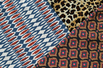 Three different types of African style textiles with colorful prints