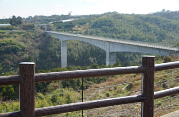 Road bridge across the valley and fence of the mountain observatory