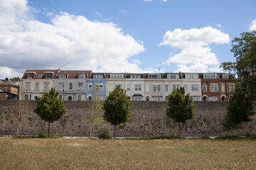 Fototapeta na wymiar Multi coloured terraced housing on the Town Wall in Southampton, Hampshire in the United Kingdom