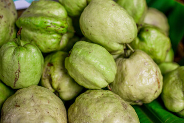 The blurred abstract background of fruits placed in a basket (lemon, guava) can be used for cooking or as a healthy alternative.