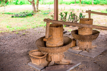 Naklejka premium Blurred abstract background of traditional tools used for milling rice, used in rural agricultural plots.