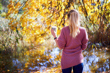 Woman against yellowed trees