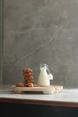 chocolate cookies with white milk on the table