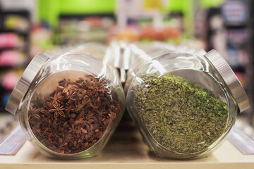 Jars with spices in supermarket
