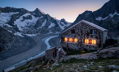 blue hour at an alpine hut in the swiss alps