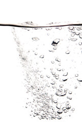 Bubble soda and black oxygen air, in underwater clear liquid with bubbles flowing up on the water surface, isolated on a white background