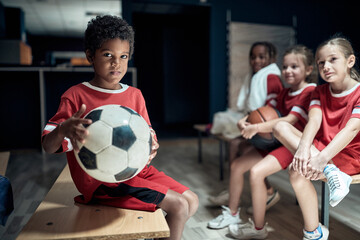 The little soccer players posing before a training