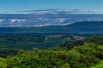 Naklejka premium Natural high angle panoramic background With an atmosphere surrounded by mountains and trees, with a blurred wind, cool