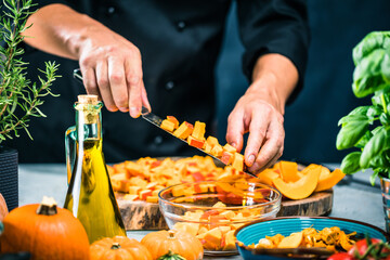 chef chopping pumpkins for pumpkin soup