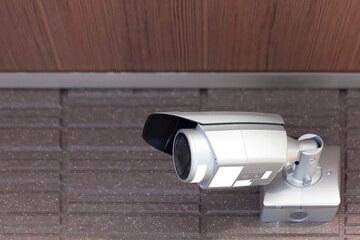 Video camera security system on the wall of the building